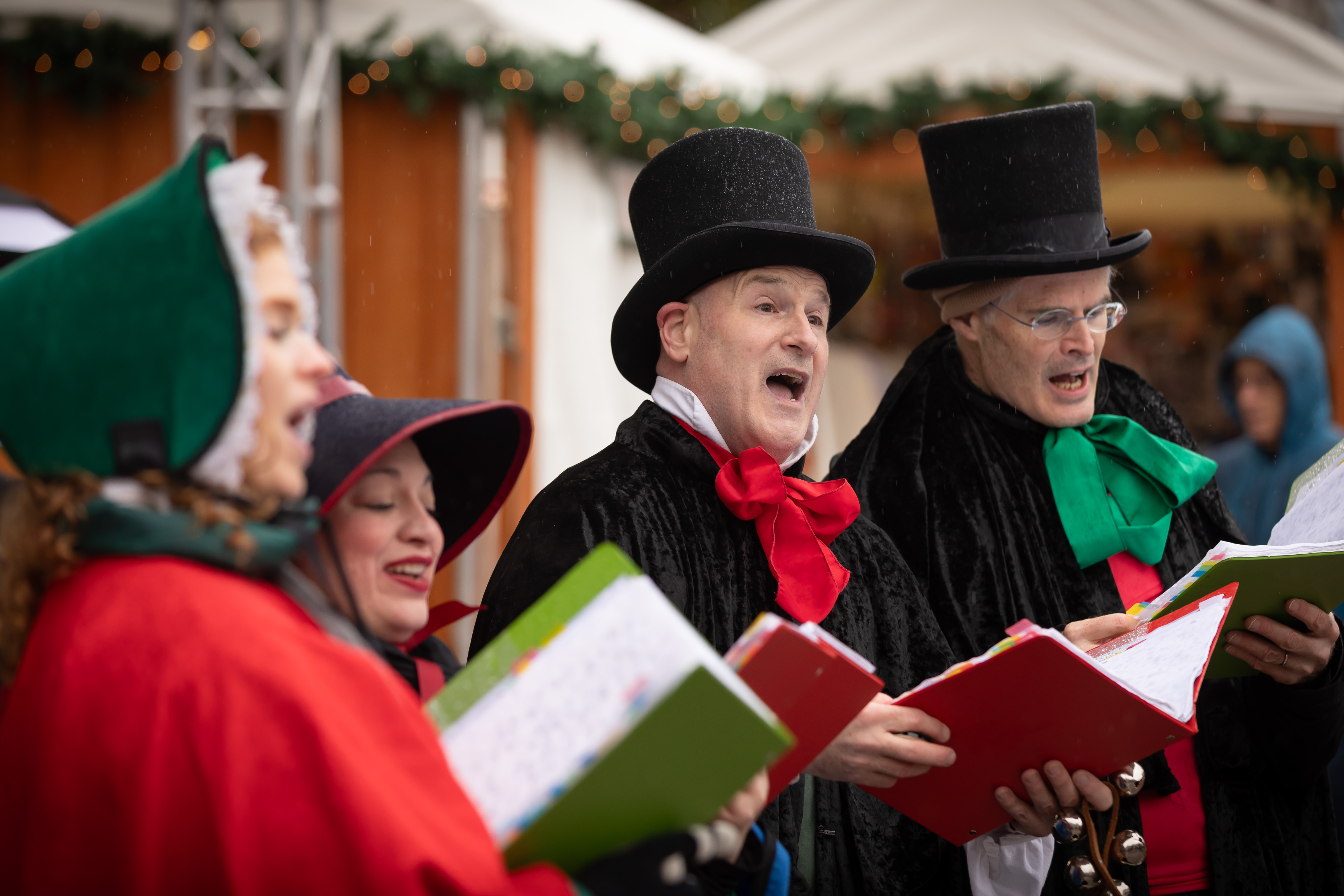 Carolers singing at the DowntownDC Holiday Market