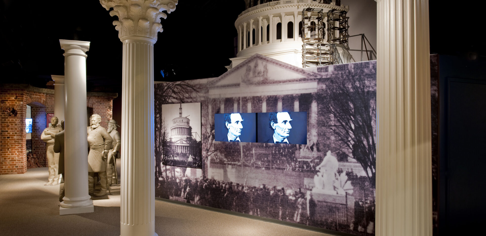 President Lincoln photo displayed on screen inside a museum building. lincoln-assissnation-tour